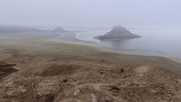 Aerial view of Karynzharyk salt flats and rock formations Kazakhstan.