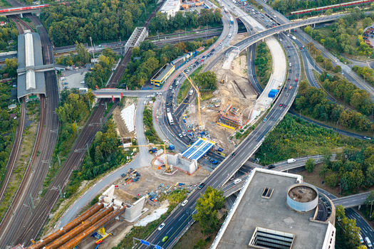 Aerial view of the Ringbahnbrucke bridge construction site at the Funkturm interchange with cranes highway traffic and railway tracks in Berlin Berlin Germany. Aerial view of the Ringbahnbrucke bridge construction site at the Funkturm interchange with cranes highway traffic and railway tracks in Berlin Berlin Germany.