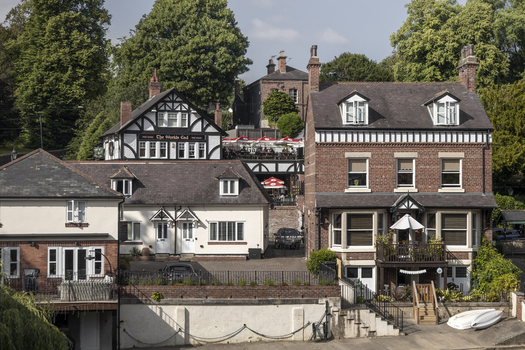 Knaresborough England 14 July 2026 View of The Worlds End pub and surrounding historic buildings along the riverbank in Knaresborough.