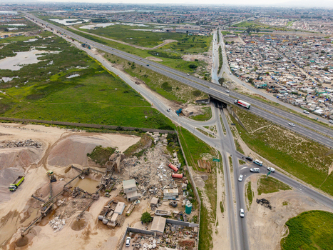 Aerial view of the highway interchange and industrial quarry site adjacent to residential areas in Philippi Cape Town Western Cape South Africa.
