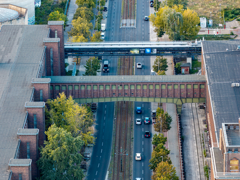 Aerial view of the historic brick architecture of the Klingenberg Power Station with its distinctive bridge spanning over the road and tram tracks Berlin Berlin Germany. Aerial view of the historic brick architecture of the Klingenberg Power Station with its distinctive bridge spanning over the road and tram tracks Berlin Berlin Germany.