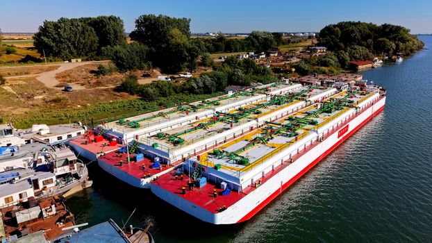 Aerial view of industrial barges docked at the shipyard on the Danube river in Smederevo Podunavlje District Serbia.