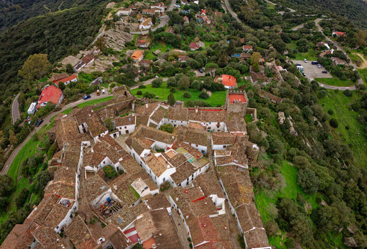 Aerial view of the historic Castellar de la Frontera castle nestled among the green trees a testament to enduring heritage Castellar de la Frontera Andalusia Spain. Aerial view of the historic Castellar de la Frontera castle nestled among the green trees a testament to enduring heritage Castellar de la Frontera Andalusia Spain.