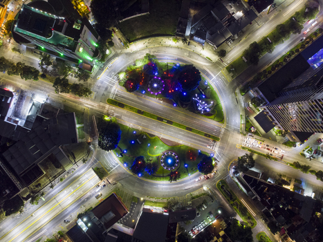 Aerial view of Glorieta Stampede at night featuring illuminated sculptures circular traffic patterns and surrounding city lights in Guadalajara Jalisco Mexico. Aerial view of Glorieta Stampede at night featuring illuminated sculptures circular traffic patterns and surrounding city lights in Guadalajara Jalisco Mexico.