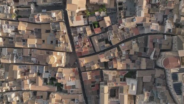 Aerial view of the historic Island of Ortigia rooftops Italy.