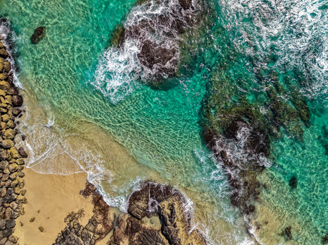 Aerial view of Cudgen Headland South Head featuring turquoise ocean waters rocky shoreline and sandy beach in Kingscliff New South Wales Australia. Aerial view of Cudgen Headland South Head featuring turquoise ocean waters rocky shoreline and sandy beach in Kingscliff New South Wales Australia.