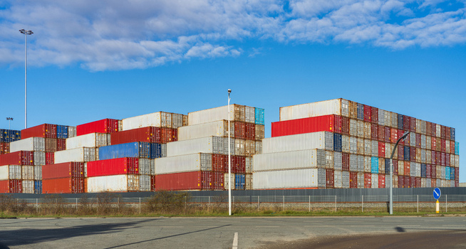 View of stacked shipping containers in various colors at the port terminal in Klaipeda Klaipeda County Lithuania. View of stacked shipping containers in various colors at the port terminal in Klaipeda Klaipeda County Lithuania.