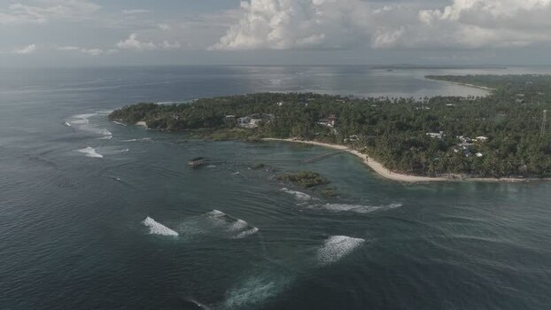 Aerial view of Cloud 9 Beach Club and coastline Philippines. Aerial view of Cloud 9 Beach Club and coastline Philippines.