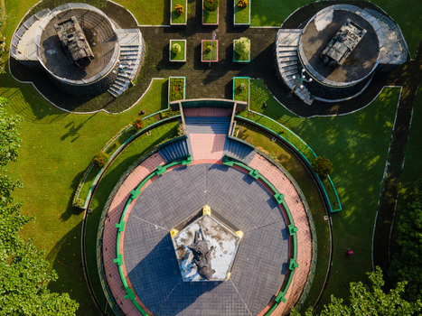 Purwokerto Indonesia 08 May 2026 Aerial view of the National Monument of Jendral Soedirman featuring a central statue and military tanks on circular platforms and green lawns. Purwokerto Indonesia 08 May 2026 Aerial view of the National Monument of Jendral Soedirman featuring a central statue and military tanks on circular platforms and green lawns.
