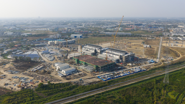 Aerial view of the Bridge Data Center under construction with cranes industrial buildings and vast landscape in Khlong Tamru Chon Buri Thailand. Aerial view of the Bridge Data Center under construction with cranes industrial buildings and vast landscape in Khlong Tamru Chon Buri Thailand.