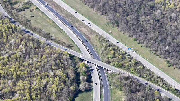 Aerial view of highway interchange near forest France.