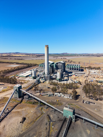 Aerial view of Millmerran Power Station with its tall chimney industrial buildings and conveyor belts set amidst the rural landscape of Domville Queensland Australia. Aerial view of Millmerran Power Station with its tall chimney industrial buildings and conveyor belts set amidst the rural landscape of Domville Queensland Australia.