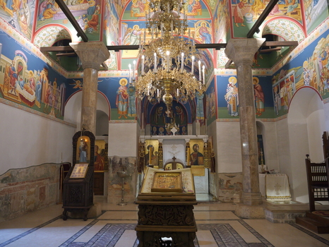 View of the interior of the Church of Saints Clement of Ohrid and Panteleimon with ornate frescoes a large chandelier and stone columns in Ohrid Municipality of Ohrid North Macedonia. View of the interior of the Church of Saints Clement of Ohrid and Panteleimon with ornate frescoes a large chandelier and stone columns in Ohrid Municipality of Ohrid North Macedonia.