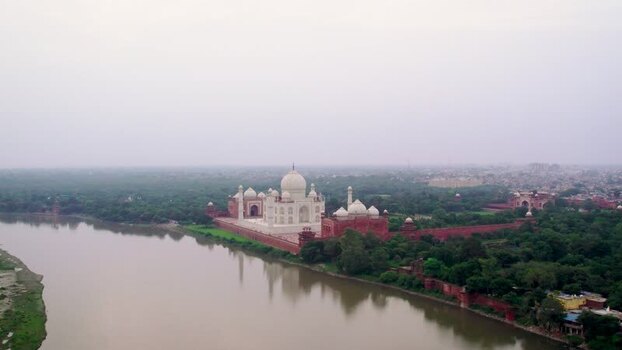 Aerial view of Taj Mahal along the Yamuna River in India. Aerial view of Taj Mahal along the Yamuna River in India.