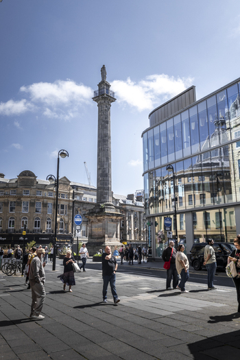 Newcastle upon Tyne United Kingdom 13 July 2026 View of Grey s Monument surrounded by historic buildings and people walking on the street under a clear blue sky. Newcastle upon Tyne United Kingdom 13 July 2026 View of Grey s Monument surrounded by historic buildings and people walking on the street under a clear blue sky.