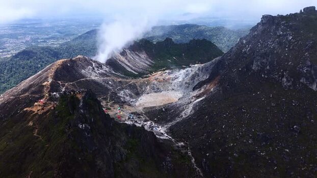Aerial view of Mount Sibayak crater with steam and hikers Indonesia. Aerial view of Mount Sibayak crater with steam and hikers Indonesia.