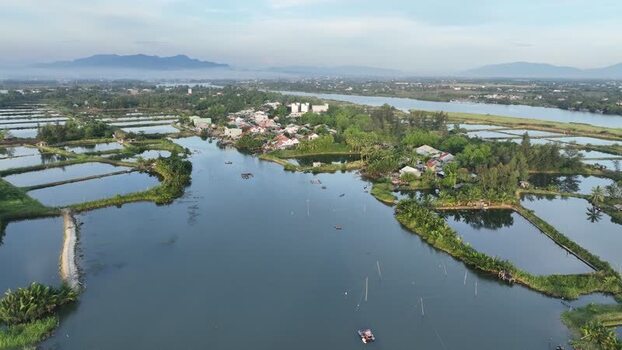 Aerial view of Thu Bon River and aquaculture ponds in Vietnam. Aerial view of Thu Bon River and aquaculture ponds in Vietnam.