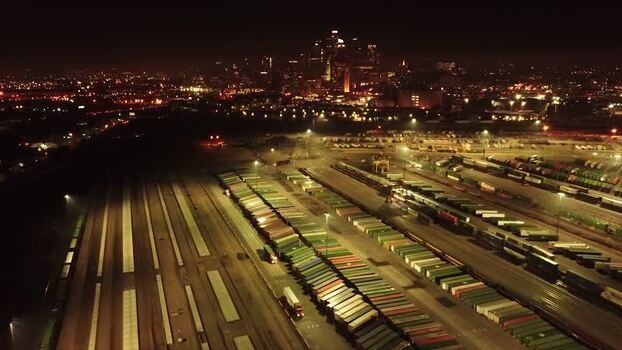 Aerial view of a container yard and the city skyline United States. Aerial view of a container yard and the city skyline United States.