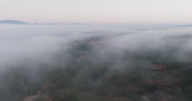 Aerial view of Balze del Valdarno rock formations in the fog Italy. Aerial view of Balze del Valdarno rock formations in the fog Italy.