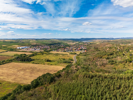 Aerial view of Egerszalok village and farmland near Matra Mountains in summer Aerial view of Egerszalok village and farmland near Matra Mountains in summer