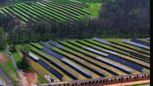 Aerial view of solar panels in a large solar farm United States. Aerial view of solar panels in a large solar farm United States.