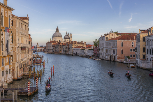 Venice Veneto Italy 21 September 2026 View of the Grand Canal with gondolas and the Santa Maria della Salute basilica in the background under a clear blue sky. Venice Veneto Italy 21 September 2026 View of the Grand Canal with gondolas and the Santa Maria della Salute basilica in the background under a clear blue sky.