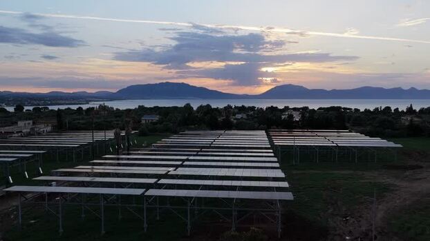 Aerial view of solar panels at sunset in Terrasini Italy.