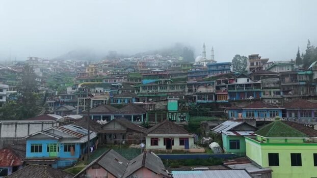 Aerial view of Nepal Van Java village on a misty hillside Indonesia.