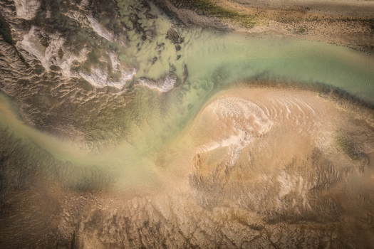 Aerial view of the intricate sandbanks and shallow water channels of Rogerstown Estuary showing natural textures and patterns Lusk County Dublin Ireland. Aerial view of the intricate sandbanks and shallow water channels of Rogerstown Estuary showing natural textures and patterns Lusk County Dublin Ireland.