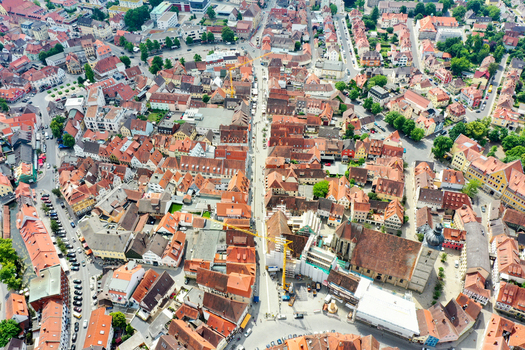 Aerial view of the historic old town of Forchheim featuring traditional red tiled rooftops narrow streets and the parish church of Saint Martin in Forchheim Bavaria Germany. Aerial view of the historic old town of Forchheim featuring traditional red tiled rooftops narrow streets and the parish church of Saint Martin in Forchheim Bavaria Germany.