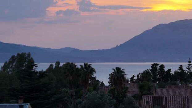 Aerial view of sunset over the sea in Terrasini Italy.