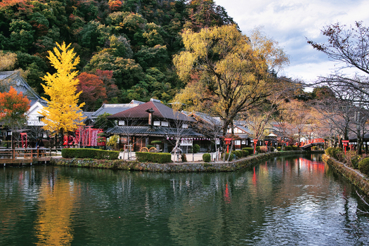 Nikko Tochigi Japan 02 November 2025 View of Edo Wonderland Nikko Edomura featuring traditional Japanese architecture a calm canal and vibrant autumn foliage. Nikko Tochigi Japan 02 November 2025 View of Edo Wonderland Nikko Edomura featuring traditional Japanese architecture a calm canal and vibrant autumn foliage.