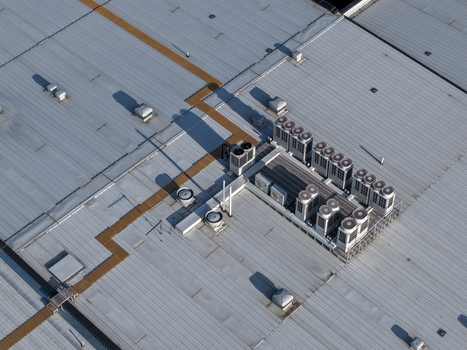 Melbourne VIC Australia 22 September 2026 Aerial view of industrial factory rooftop in Kilsyth featuring multiple HVAC units and ventilation systems under clear daylight. Melbourne VIC Australia 22 September 2026 Aerial view of industrial factory rooftop in Kilsyth featuring multiple HVAC units and ventilation systems under clear daylight.
