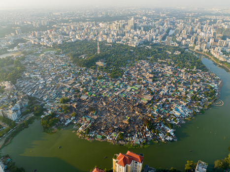 Aerial view of a sprawling urban landscape contrasting with the serene green of Hatirjheel lake and Baldha Garden Dhaka Dhaka Division Bangladesh. Aerial view of a sprawling urban landscape contrasting with the serene green of Hatirjheel lake and Baldha Garden Dhaka Dhaka Division Bangladesh.
