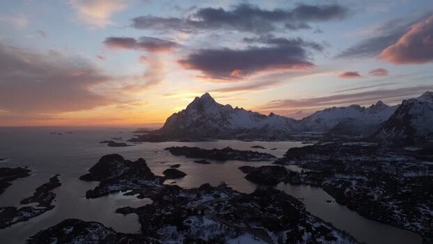 Aerial view of Lofoten mountains at sunset in Norway.