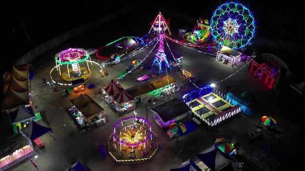 Aerial view of a night carnival with amusement rides Indonesia.