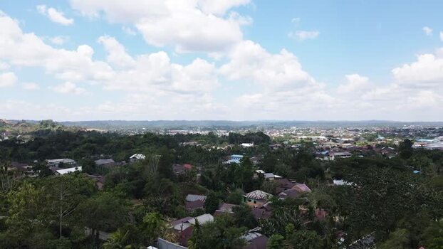 Aerial view of a town in the lush landscape of Papua Indonesia.