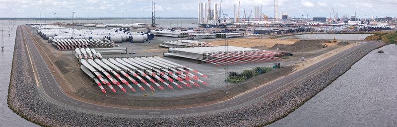 Esbjerg Denmark 24 July 2026 Aerial view of Esbjerg Port with rows of Vestas wind turbine blades and mast elements stored on the ground waiting for transport to offshore wind farms.