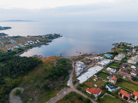 Aerial view of Arapya bay featuring coastal residential buildings construction sites and green landscapes along the Black Sea coast in Burgas Bulgaria. Aerial view of Arapya bay featuring coastal residential buildings construction sites and green landscapes along the Black Sea coast in Burgas Bulgaria.