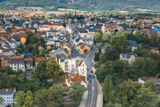Aerial view of the historic town of Saalfeld with its dense urban layout traditional rooftops church spires and surrounding green landscape in Saalfeld Thuringia Germany. Aerial view of the historic town of Saalfeld with its dense urban layout traditional rooftops church spires and surrounding green landscape in Saalfeld Thuringia Germany.