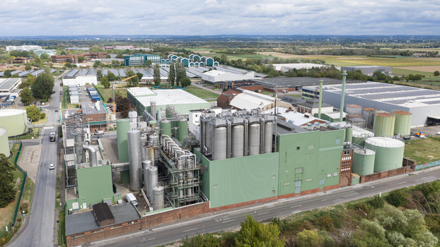 Monheim am Rhein Germany 04 September 2026 Aerial view of the UNIFERM GmbH Co. KG industrial facility with large storage tanks processing towers and factory buildings.
