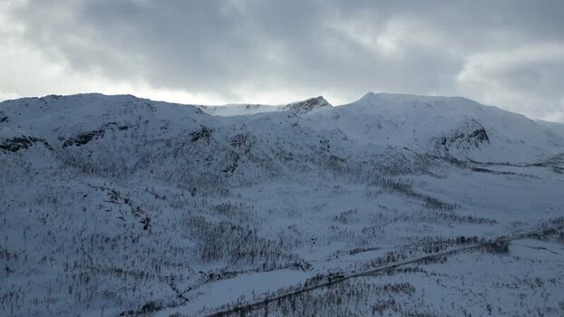 Aerial view of snow covered mountains of Kvaloya Norway.