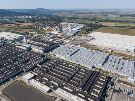 Aerial view of the Volkswagen plant near Devinska Nova Ves featuring vast industrial buildings and surrounding green landscape in Bratislava Bratislavsky kraj Slovakia. Aerial view of the Volkswagen plant near Devinska Nova Ves featuring vast industrial buildings and surrounding green landscape in Bratislava Bratislavsky kraj Slovakia.