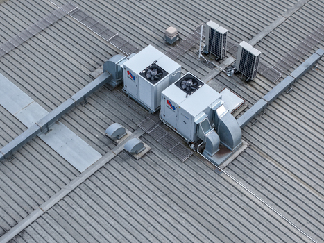 Melbourne VIC Australia 25 September 2026 Aerial view of industrial HVAC units and ventilation systems installed on a corrugated metal rooftop.