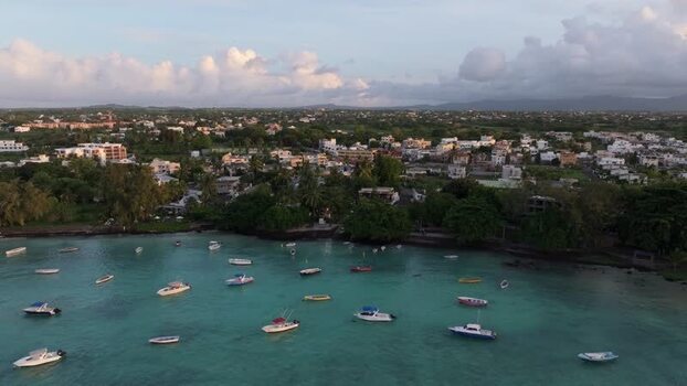 Aerial view of Cap Malheureux with boats in turquoise water Mauritius.