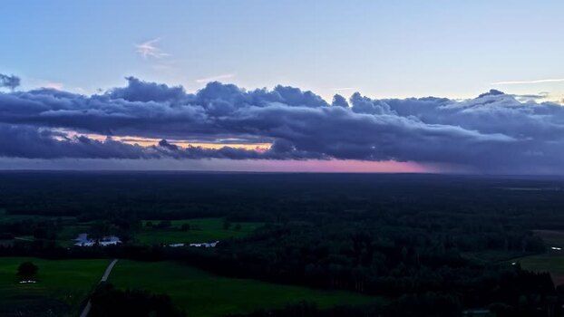 Aerial view of dramatic sunset clouds over the landscape Latvia. Aerial view of dramatic sunset clouds over the landscape Latvia.