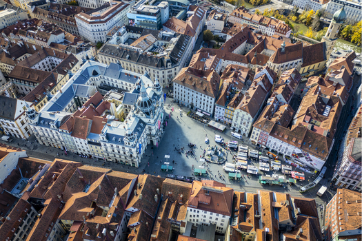 Aerial view of Hauptplatz square bustling with activity the architectural details of the buildings contrasting with the vibrant street life Graz Styria Austria.
