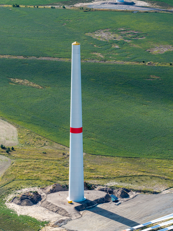Aerial view of the wind turbine tower at Windpark Forst Briesnig II situated on recultivated land in a green field in Forst Brandenburg Germany. Aerial view of the wind turbine tower at Windpark Forst Briesnig II situated on recultivated land in a green field in Forst Brandenburg Germany.