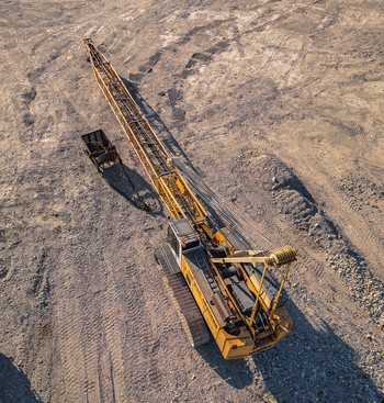 Le Pouzin Auvergne Rhone Alpes France 04 July 2026 Aerial view of a Liebherr HS 845 crawler crane operating in a quarry with gravel tracks and heavy machinery. Le Pouzin Auvergne Rhone Alpes France 04 July 2026 Aerial view of a Liebherr HS 845 crawler crane operating in a quarry with gravel tracks and heavy machinery.