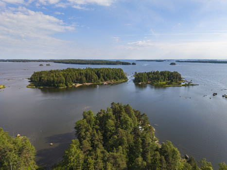 Aerial view of the forested islands and rocky coastlines of the Hamina archipelago surrounded by the calm waters of the Gulf of Finland in Hamina Kymenlaakso Finland. Aerial view of the forested islands and rocky coastlines of the Hamina archipelago surrounded by the calm waters of the Gulf of Finland in Hamina Kymenlaakso Finland.
